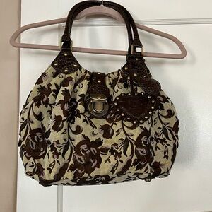 Sharif handbag NWOT. Vintage feel with hues of brown, gold, and taupe.